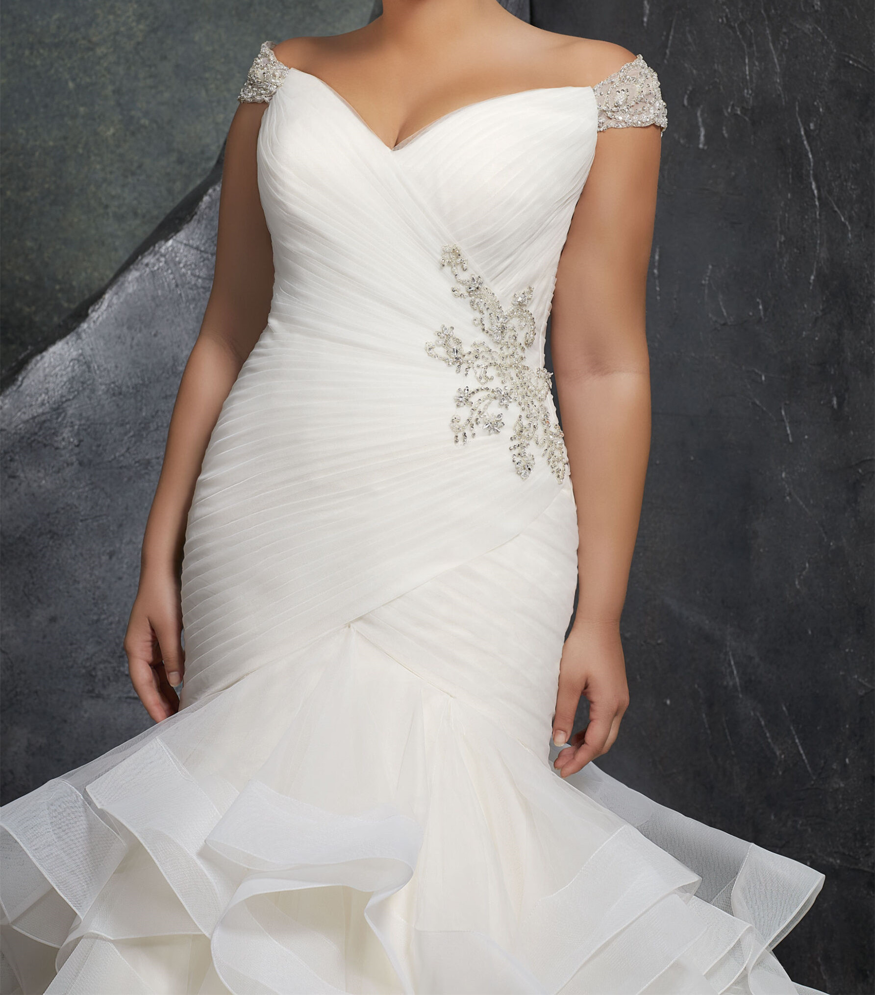 Asymmetrically Draped Tulle Creates a Figure Flattering Mermaid Silhouette with Off-the-Shoulder Beaded Cap Sleeves