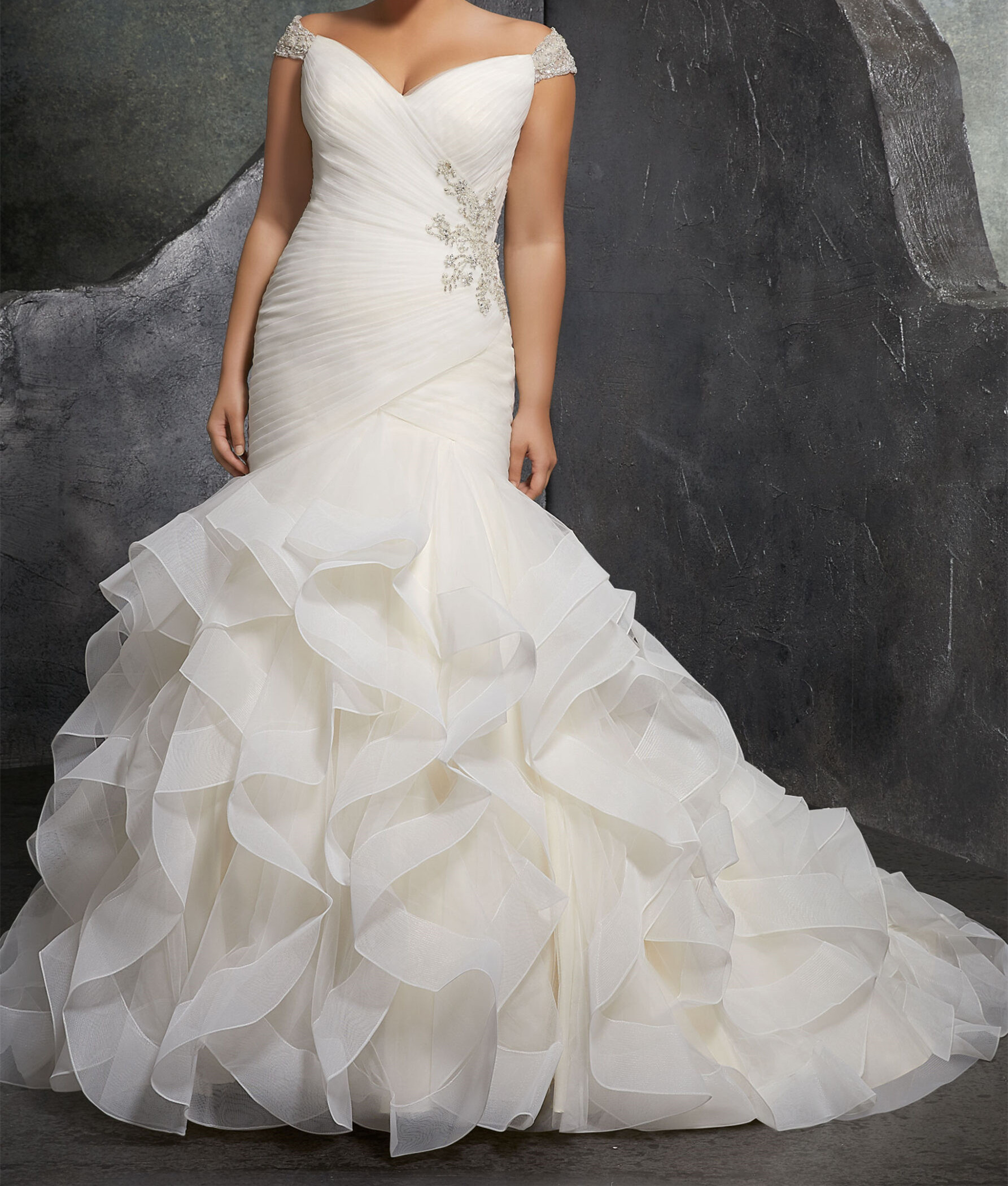 Asymmetrically Draped Tulle Creates a Figure Flattering Mermaid Silhouette with Off-the-Shoulder Beaded Cap Sleeves