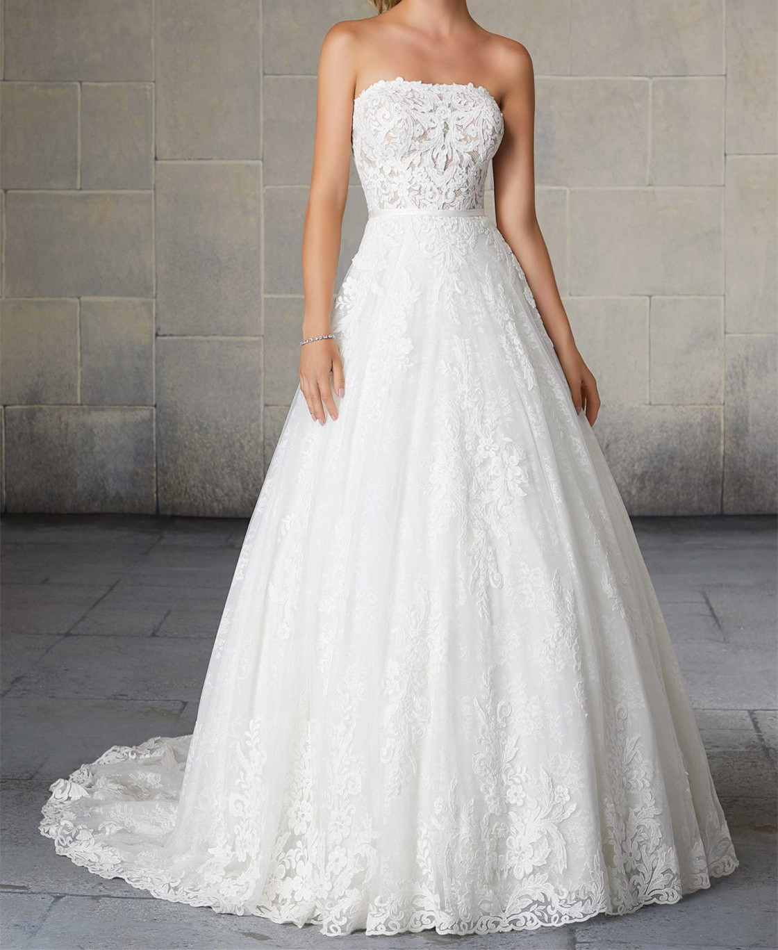  A-line ball gown silhouette trimmed with a satin waistband and scalloped hemline