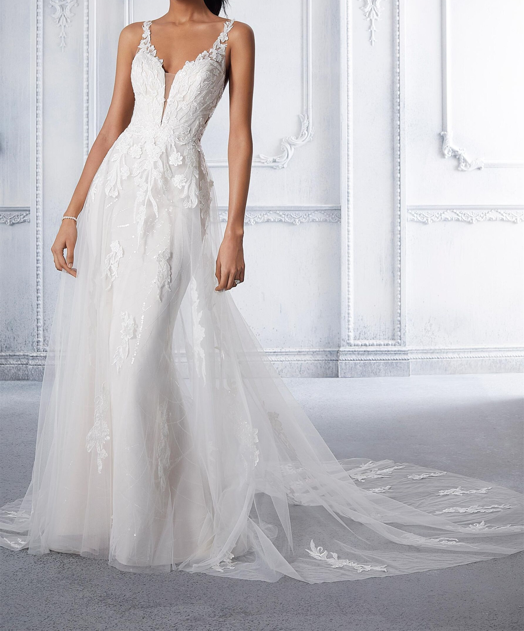 Net wedding gown  a soft net overskirt featuring a plunging v-neckline and scoop back