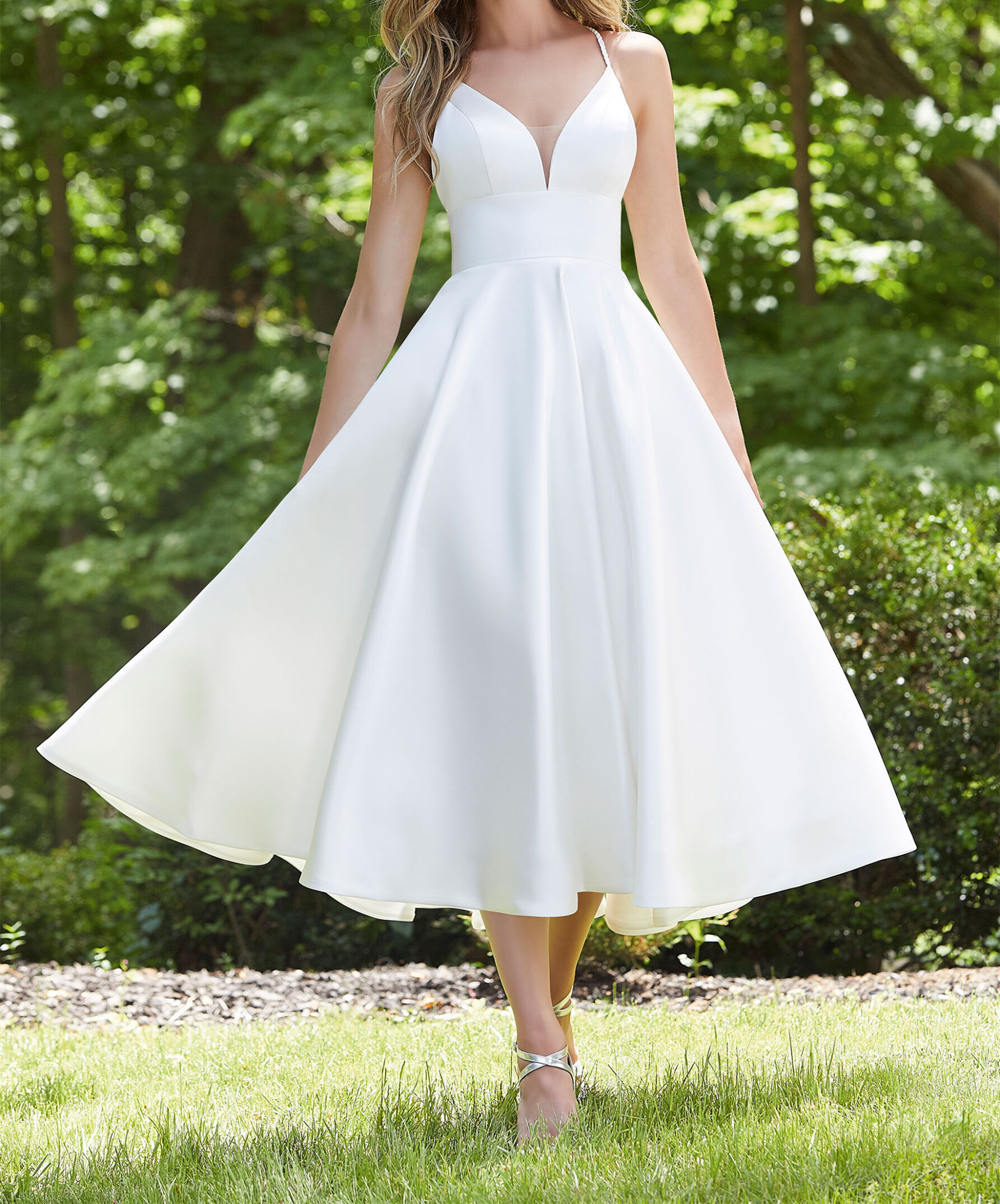 Fresh and fun our tea length satin wedding dress features a sculptured v-neckline with mesh inset